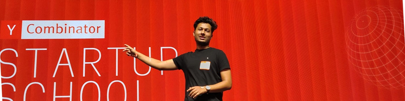 Ayaan Khan speaking on stage at Y Combinator Startup School